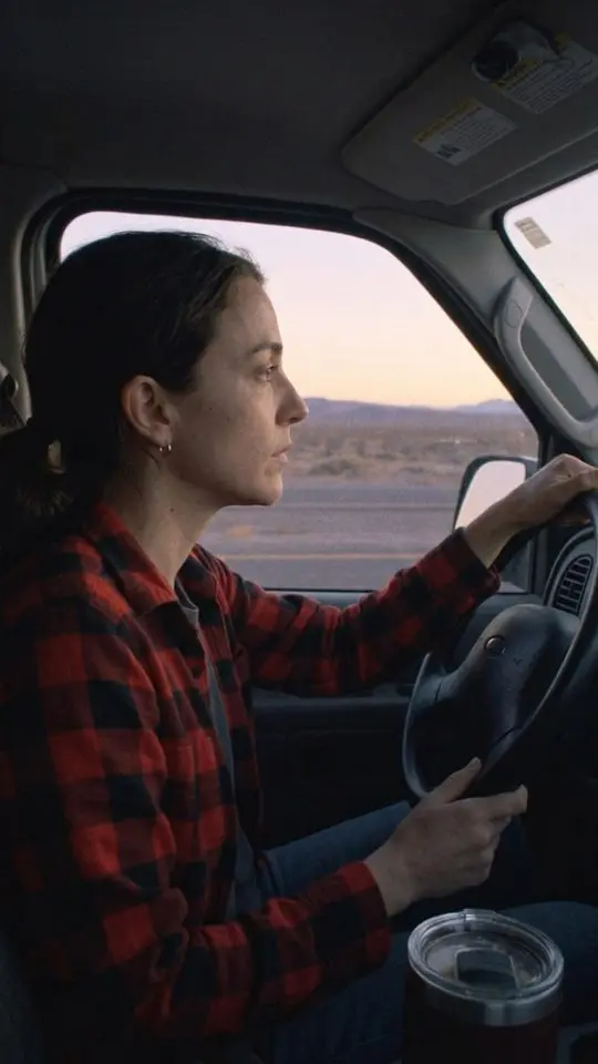 Cass Adler driving at dawn